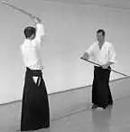 Advancing in chudan kamae.